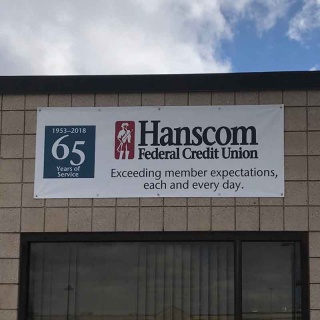Hanscom FCU celebrates 65 years of service with commemorative signage