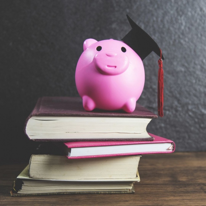 Piggy bank wearing a graduation cap