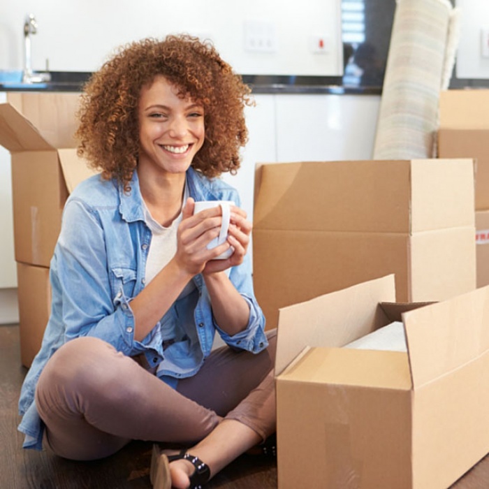 woman-surrounded-by-moving-boxes