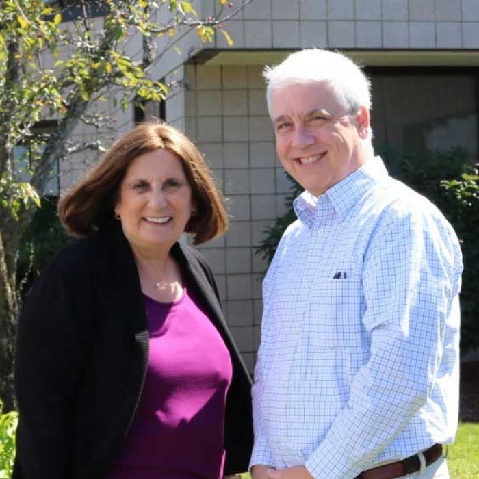 Elaine Jones stands with COO Jim Potter outside of the Hanscom AFB branch of Hanscom FCU