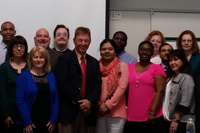 Rex Johnson (center, red tie) with participants from Hanscom FCU’s training session.