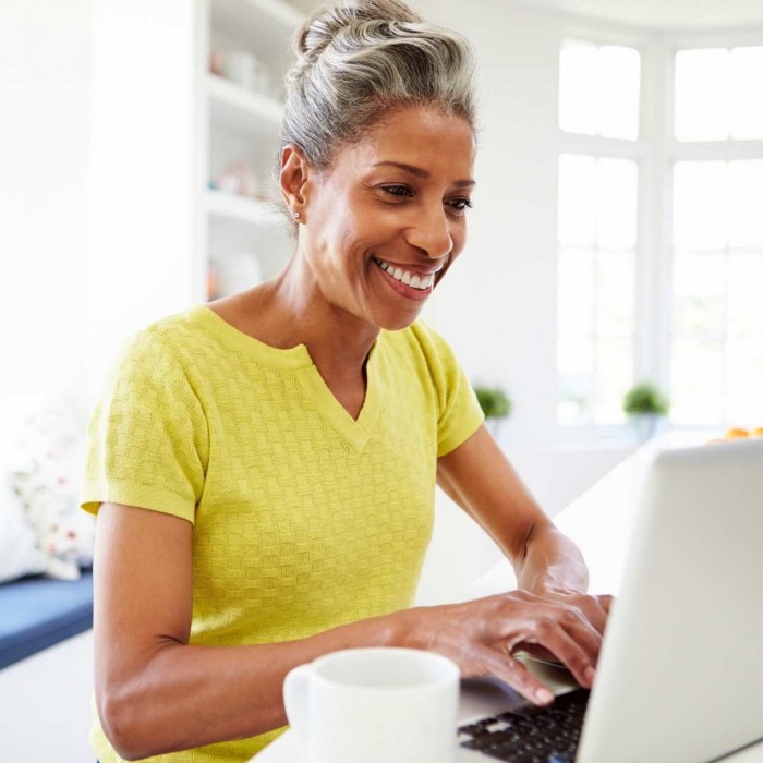 Woman attending virtual meeting