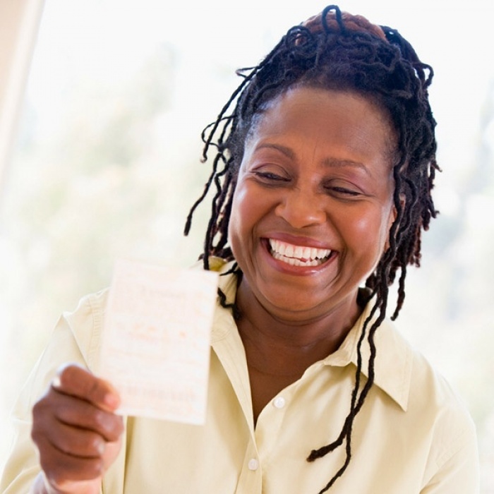 Woman-with-lottery-ticket