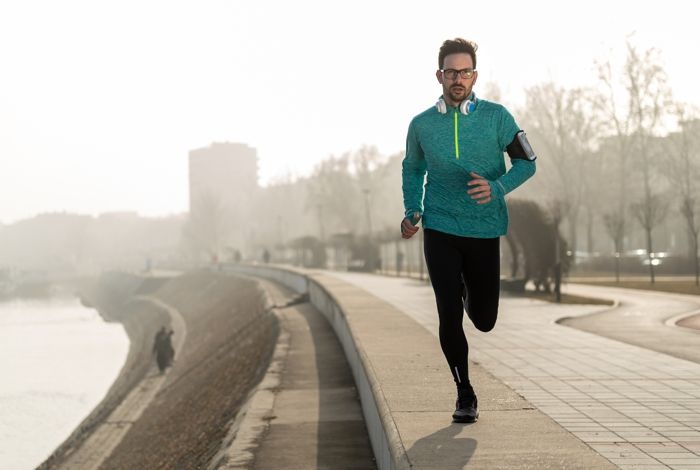 man jogging along the waterfront