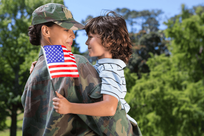 veteran holding a child