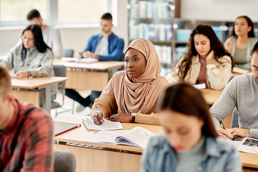 students sitting at desks in a classroom