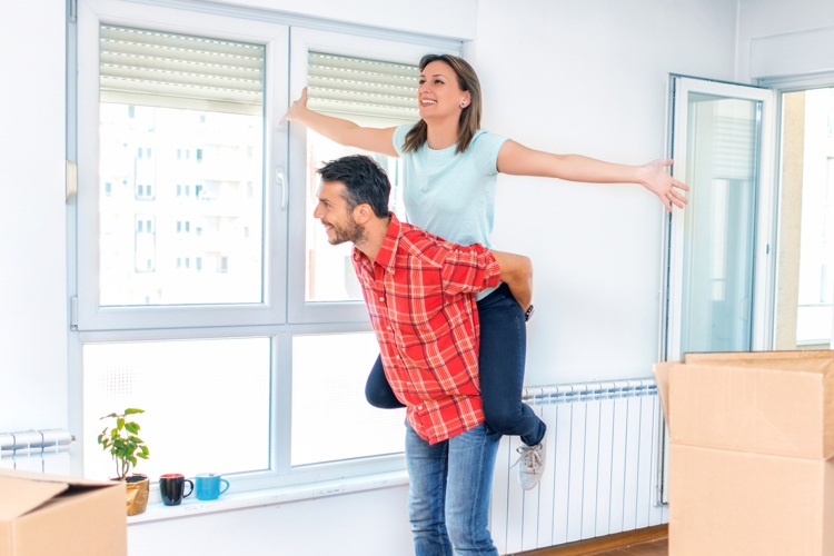 couple at new home with boxes