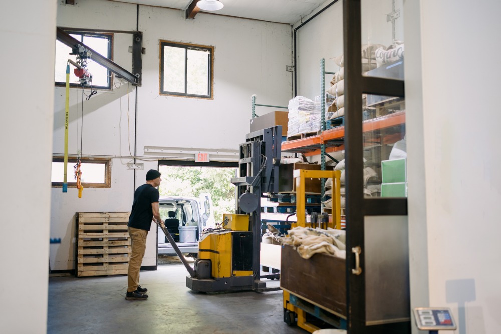 forklift operator working in warehouse