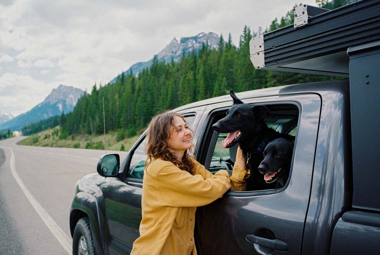 woman with car and dog