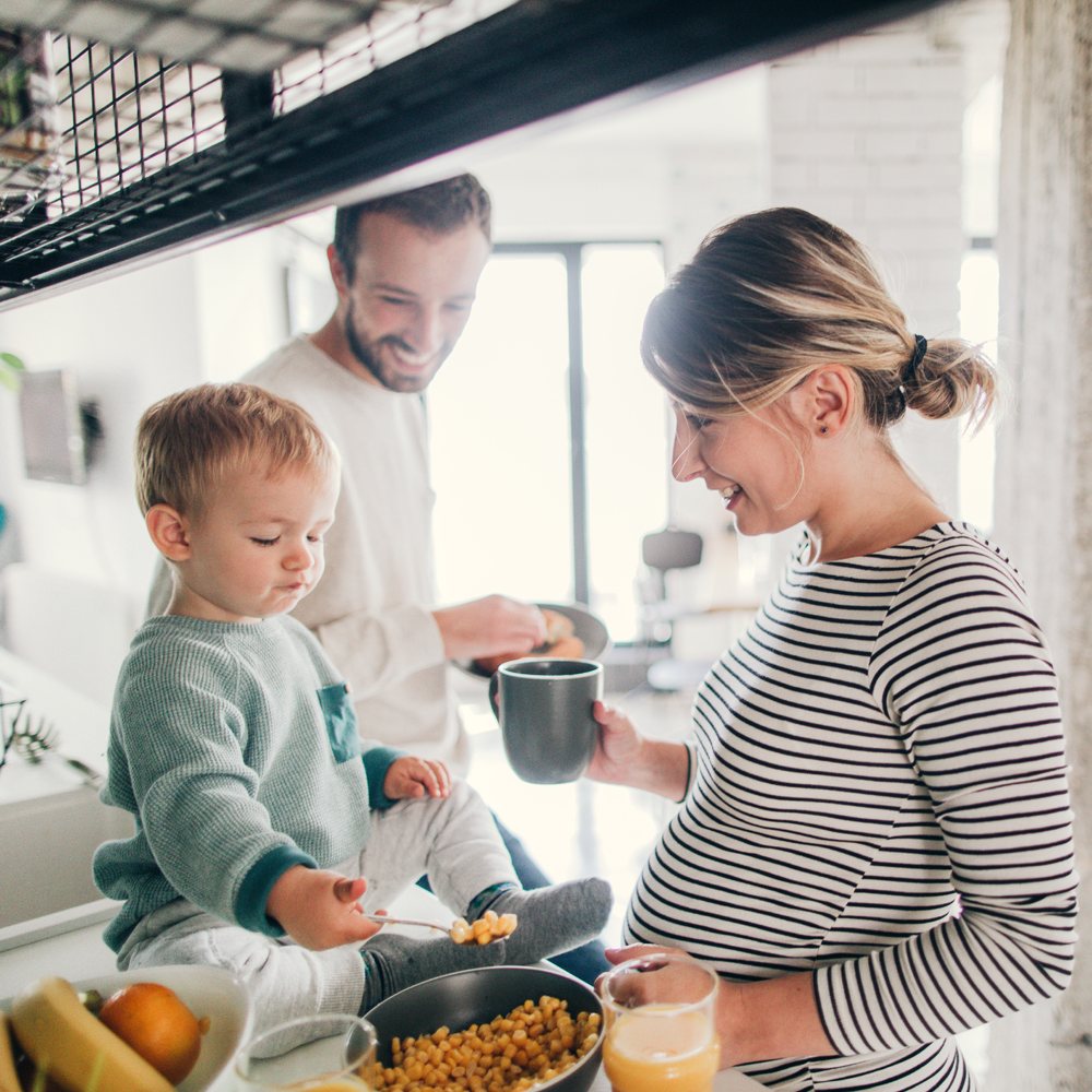 crowded kitchen with toddler mom and dad